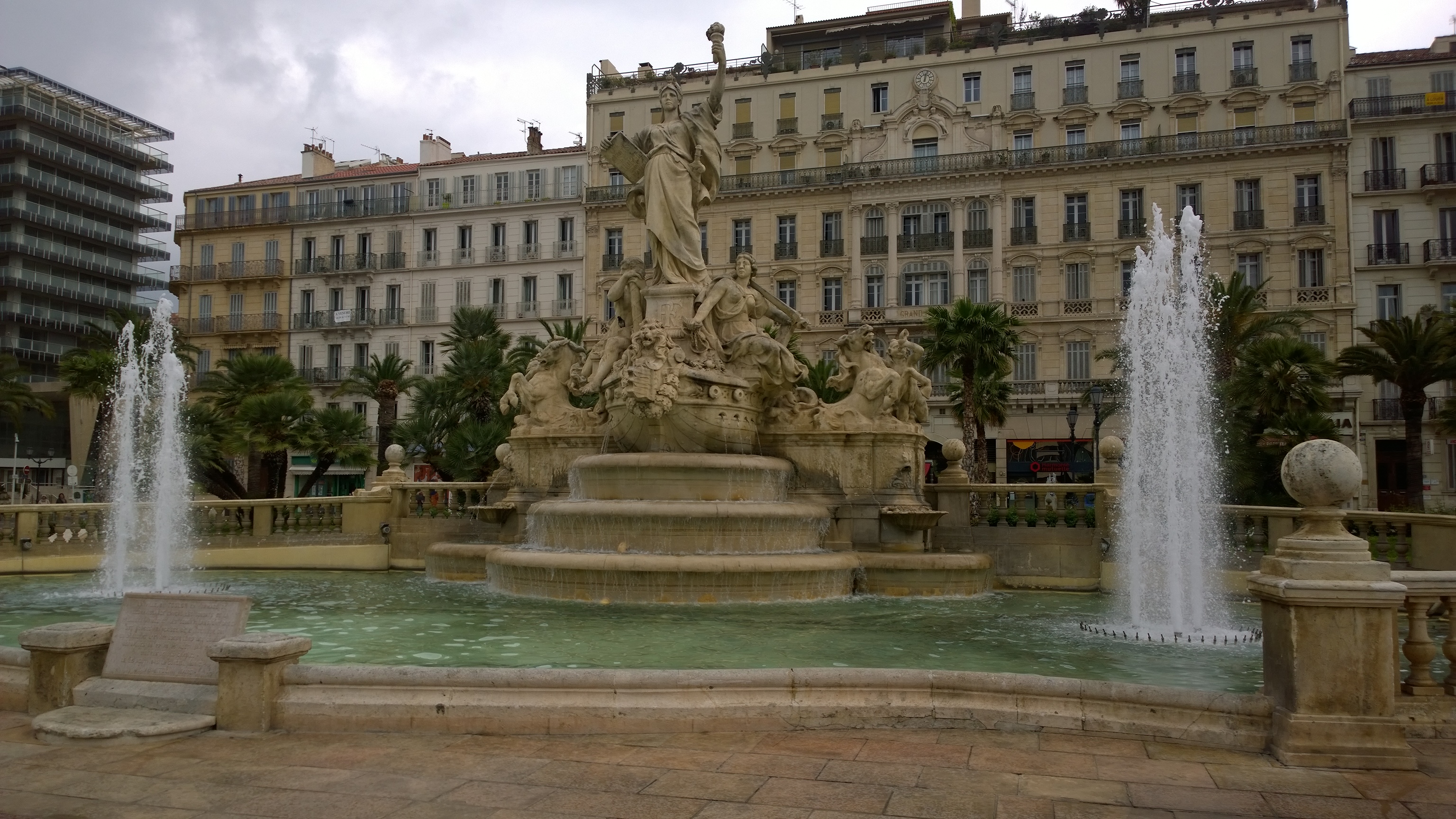 Elegant Fountain In A City Square, buildings fine art print by UNFRAMED Archive, 24 x 16 in